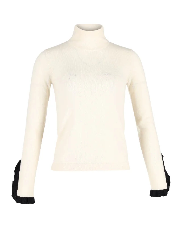 Temperley London Ruffled Sleeve Hem Turtleneck Top in Cream Cotton